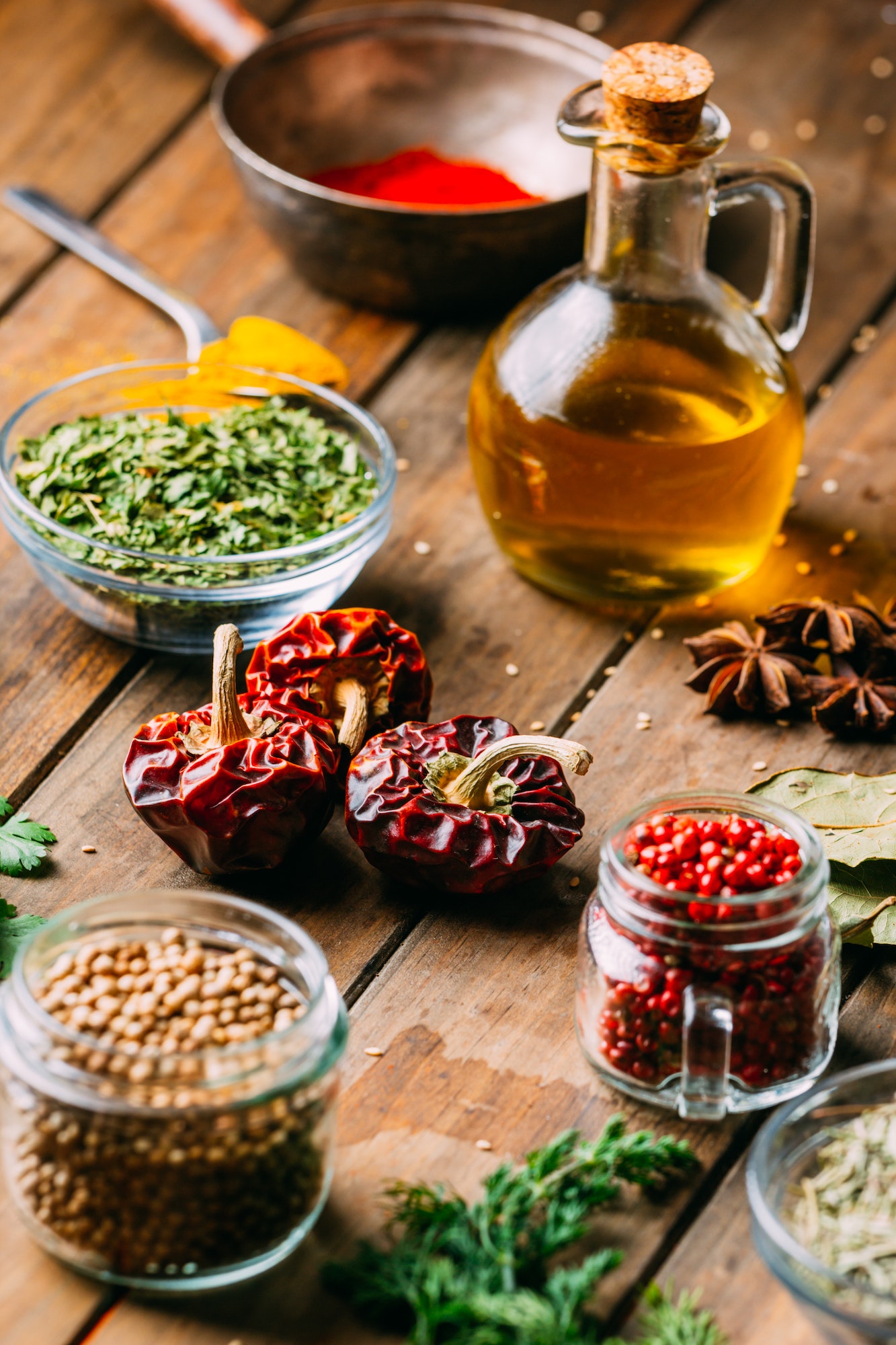 Spices and oil on table